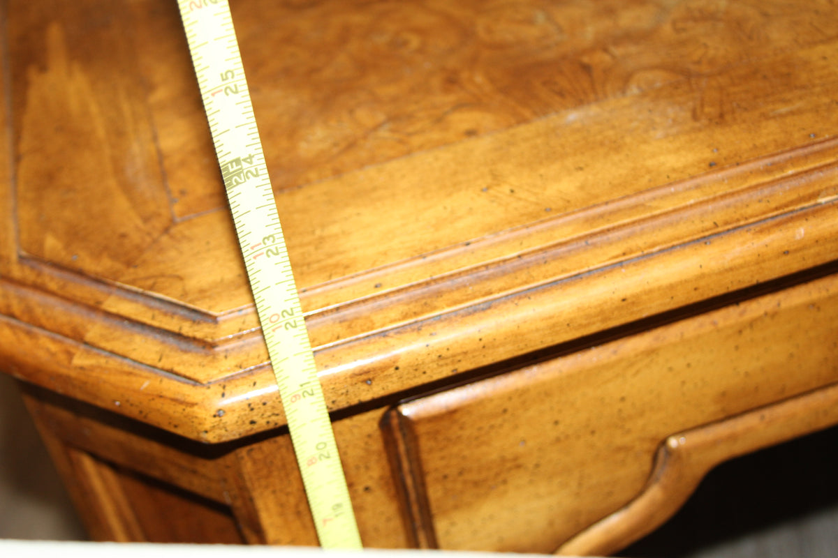 Measurement of end table height with tape measure at corner