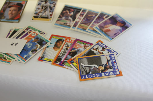 Close-up of vintage baseball trading cards, including Mike Scott