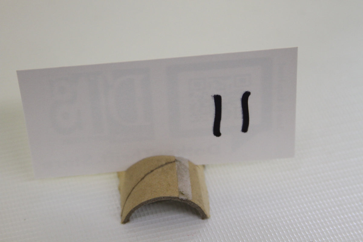Card stand with hand-marked number eleven for reference
