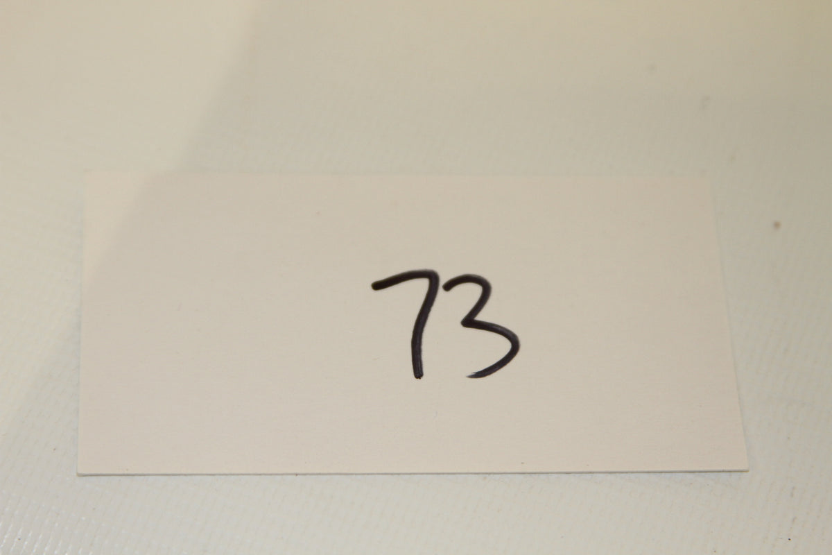 Inventory card labeled 73 for coin set