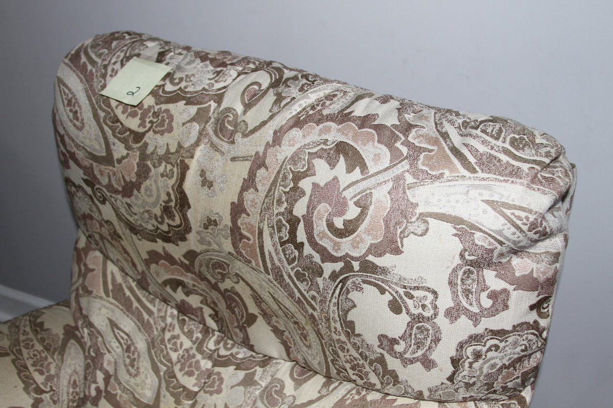 Top backrest view showing paisley fabric and head cushion