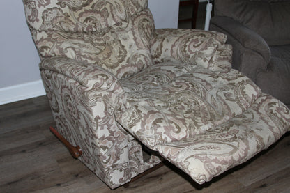 Recliner chair fully extended with footrest out in paisley fabric