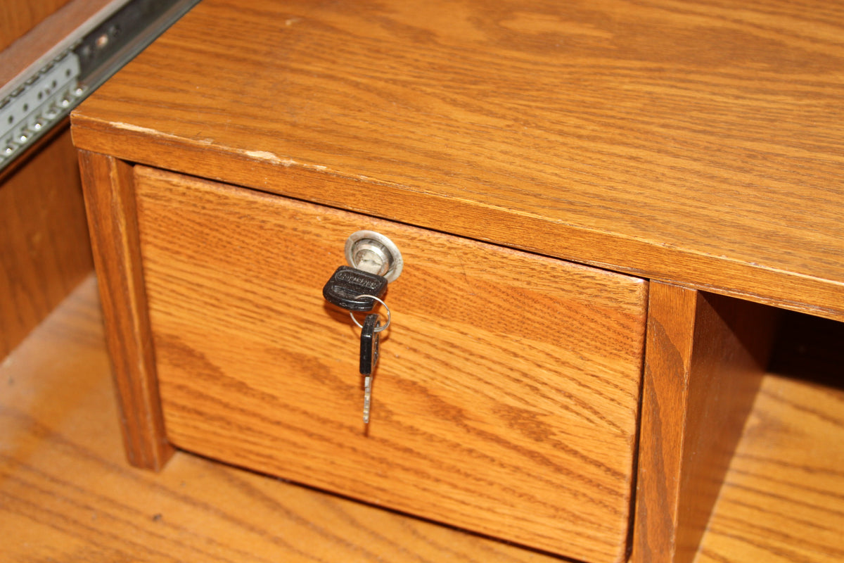 Interior lockable drawer with keys inside oak armoire