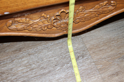 Measuring tape showing overall height of oak armoire from base