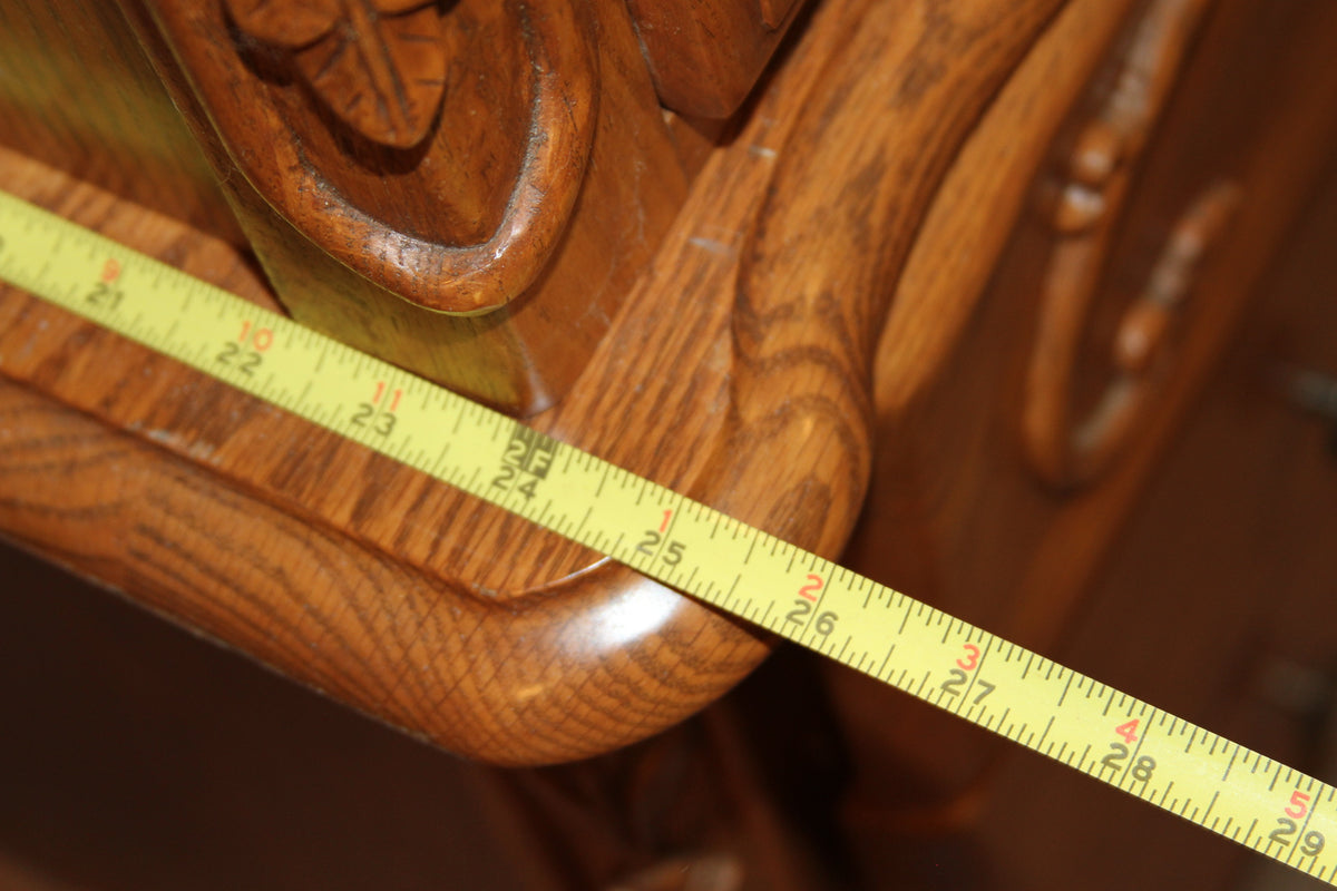 Close-up of measuring tape on exterior curve of armoire