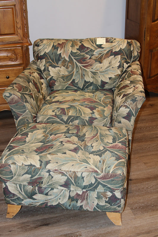Club chair and matching ottoman with green and cream leaf tapestry upholstery