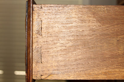 Dovetail construction close-up on drawer corner of carved walnut buffet