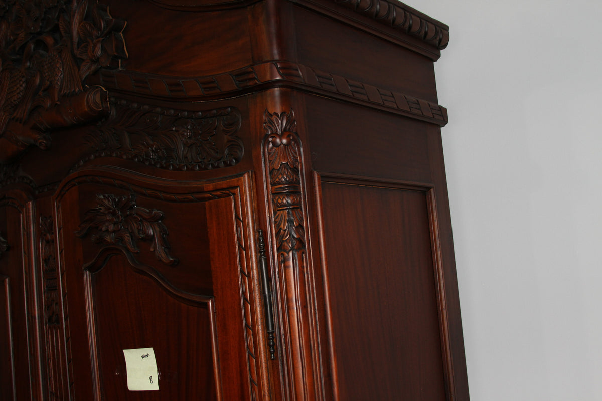 Side view of armoire highlighting carved pilaster and panel