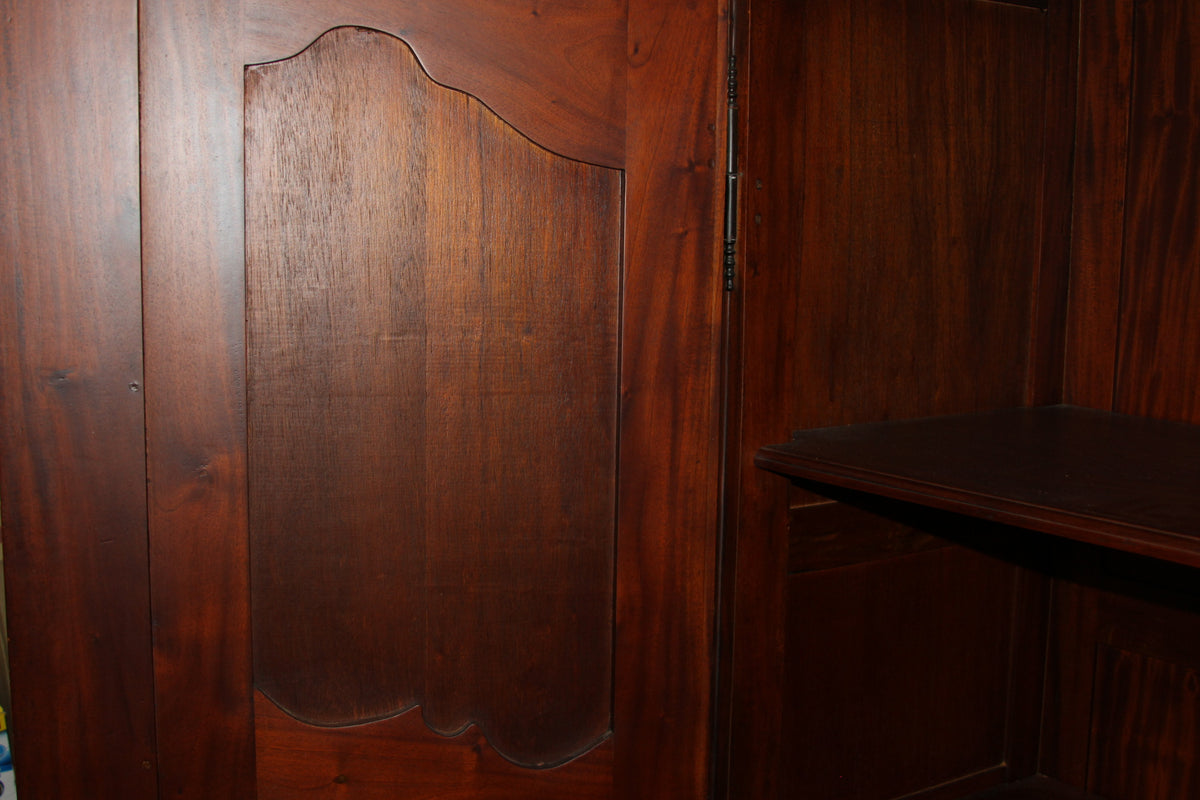 Inner side panel detail of mahogany armoire