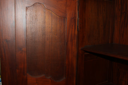 Inner side panel detail of mahogany armoire