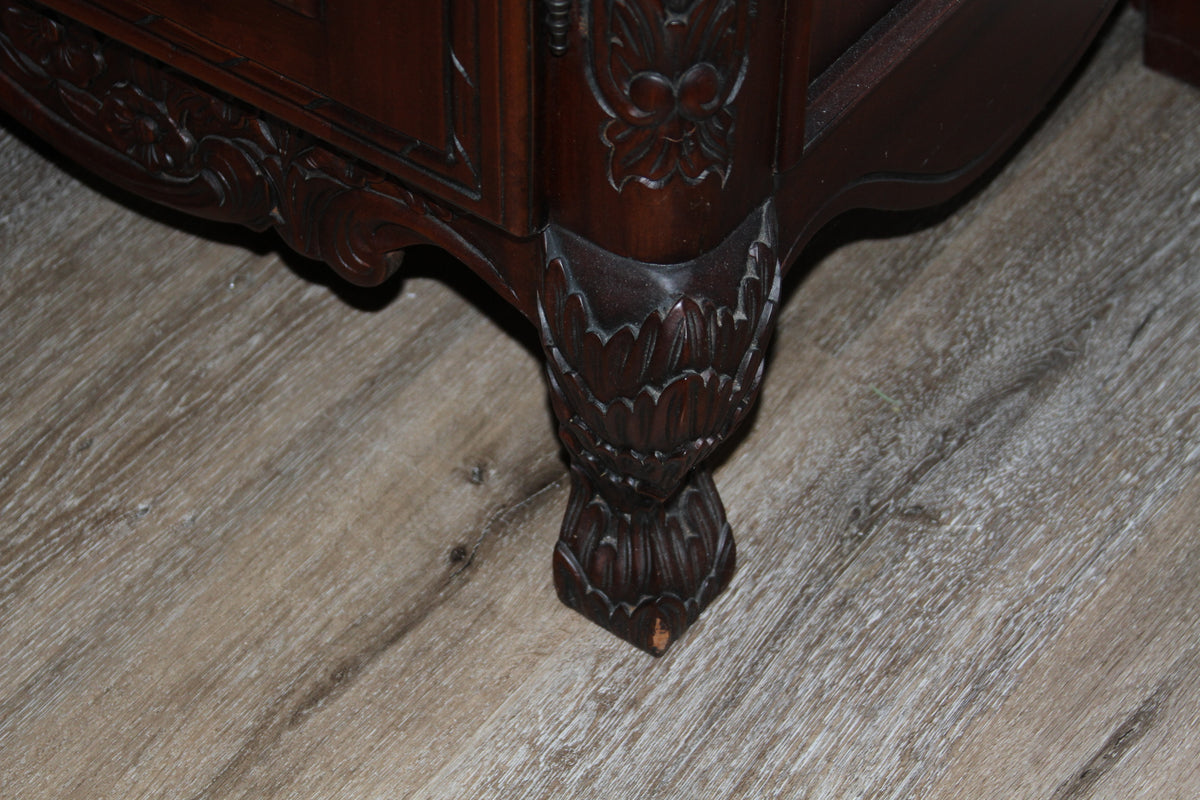 Carved armoire bracket foot with floral detailing