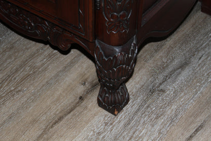Carved armoire bracket foot with floral detailing
