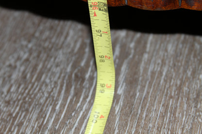 Tape measure showing armoire height of approximately 98 inches