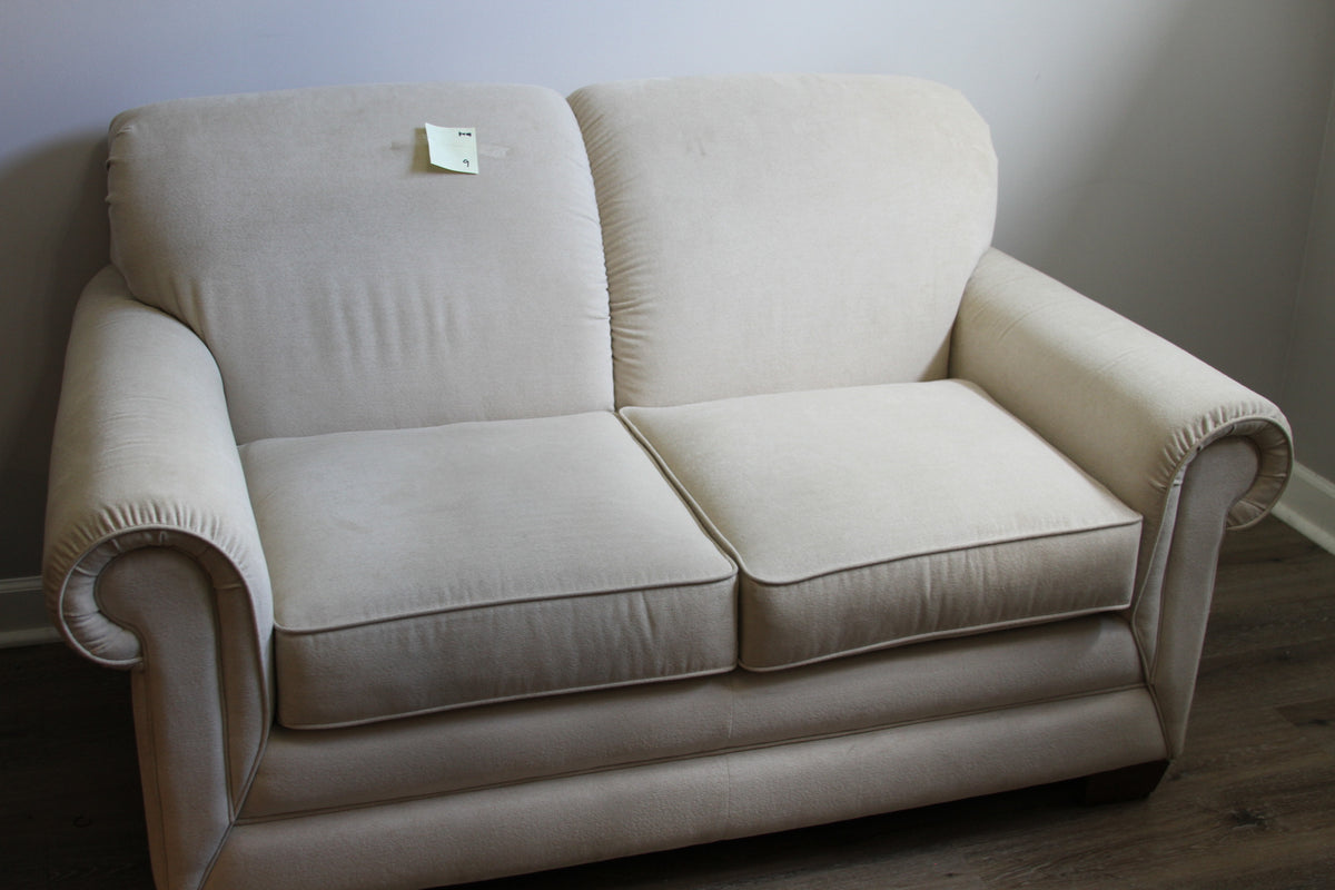 La-Z-Boy cream velvet loveseat with two seat cushions and rolled arms