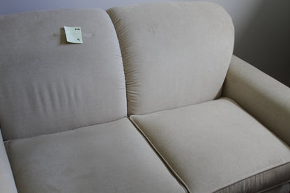 Detailed view of La-Z-Boy cream loveseat back and seat cushions