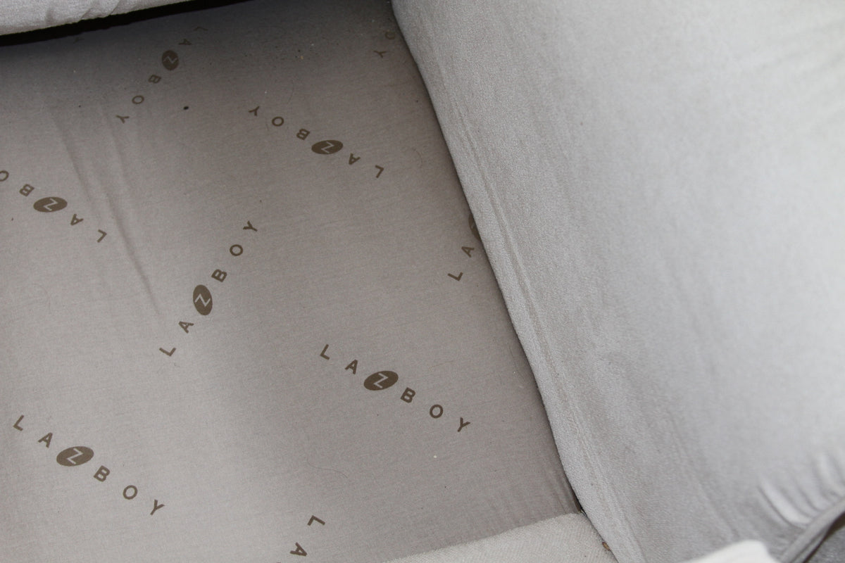 La-Z-Boy branded dust cover underneath loveseat cushions