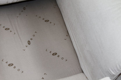 La-Z-Boy branded dust cover underneath loveseat cushions