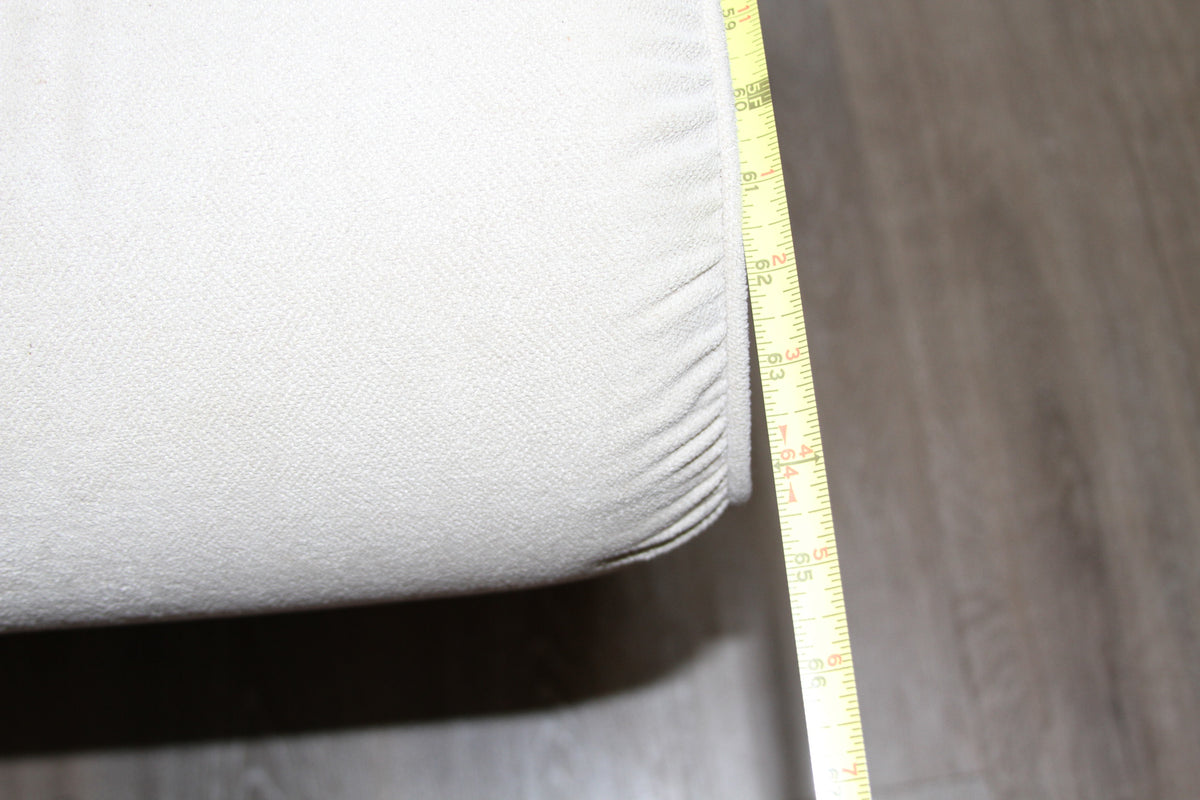 Alternate angle of width measurement on La-Z-Boy cream loveseat