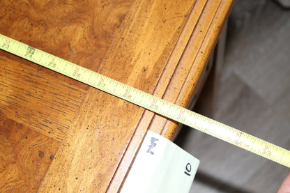 Measurement of end table width with tape measure