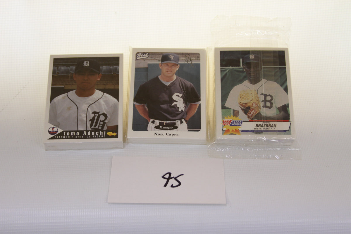Three Bristol minor league baseball card sets displayed with index card and packs