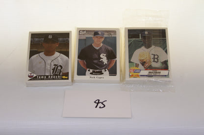 Three Bristol minor league baseball card sets displayed with index card and packs
