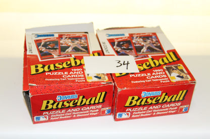 Two boxes of 1990 Donruss Baseball Puzzle and Cards with the number 34 card in front