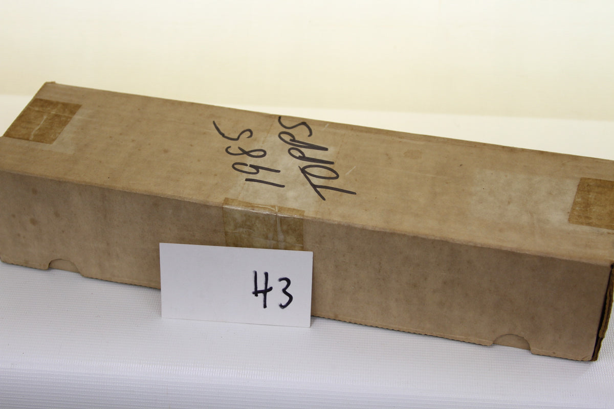 Closed vintage brown box labeled 1985 Topps with number 43 card