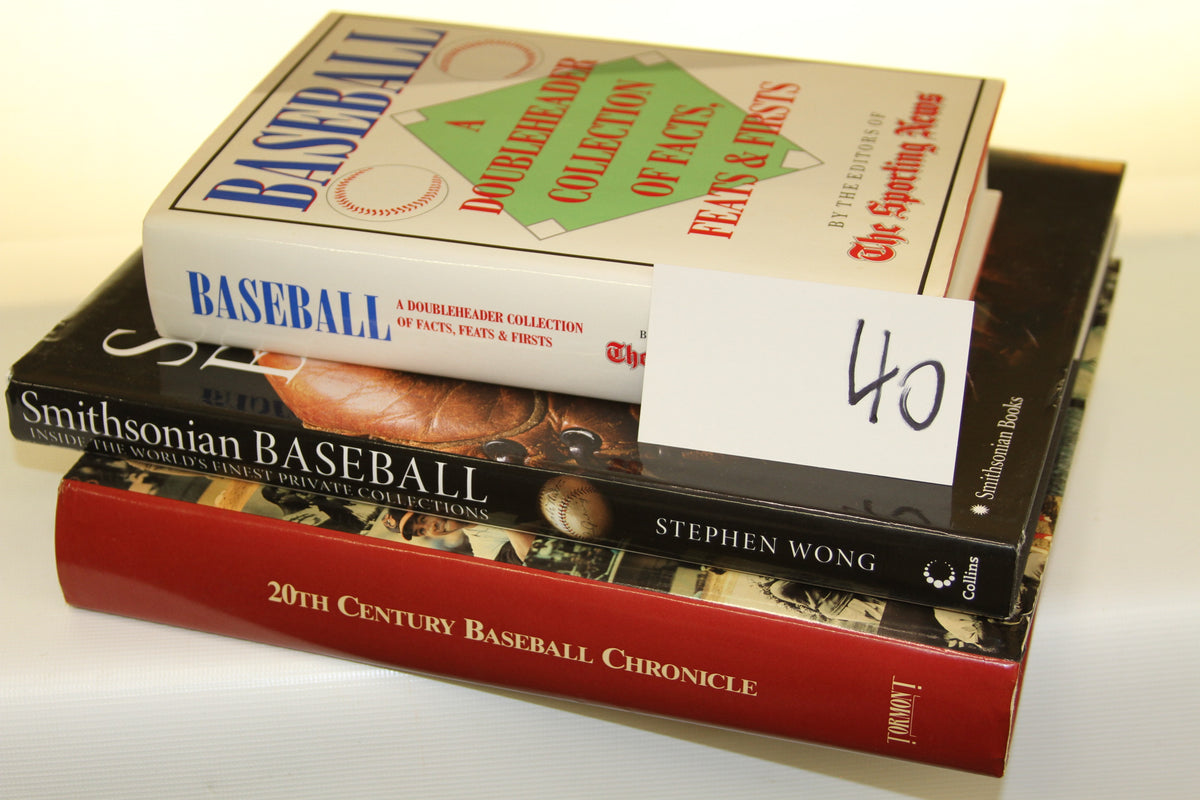 Stack of three baseball history hardcover books with a card labeled 40
