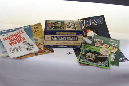 Assorted vintage baseball card books on a table