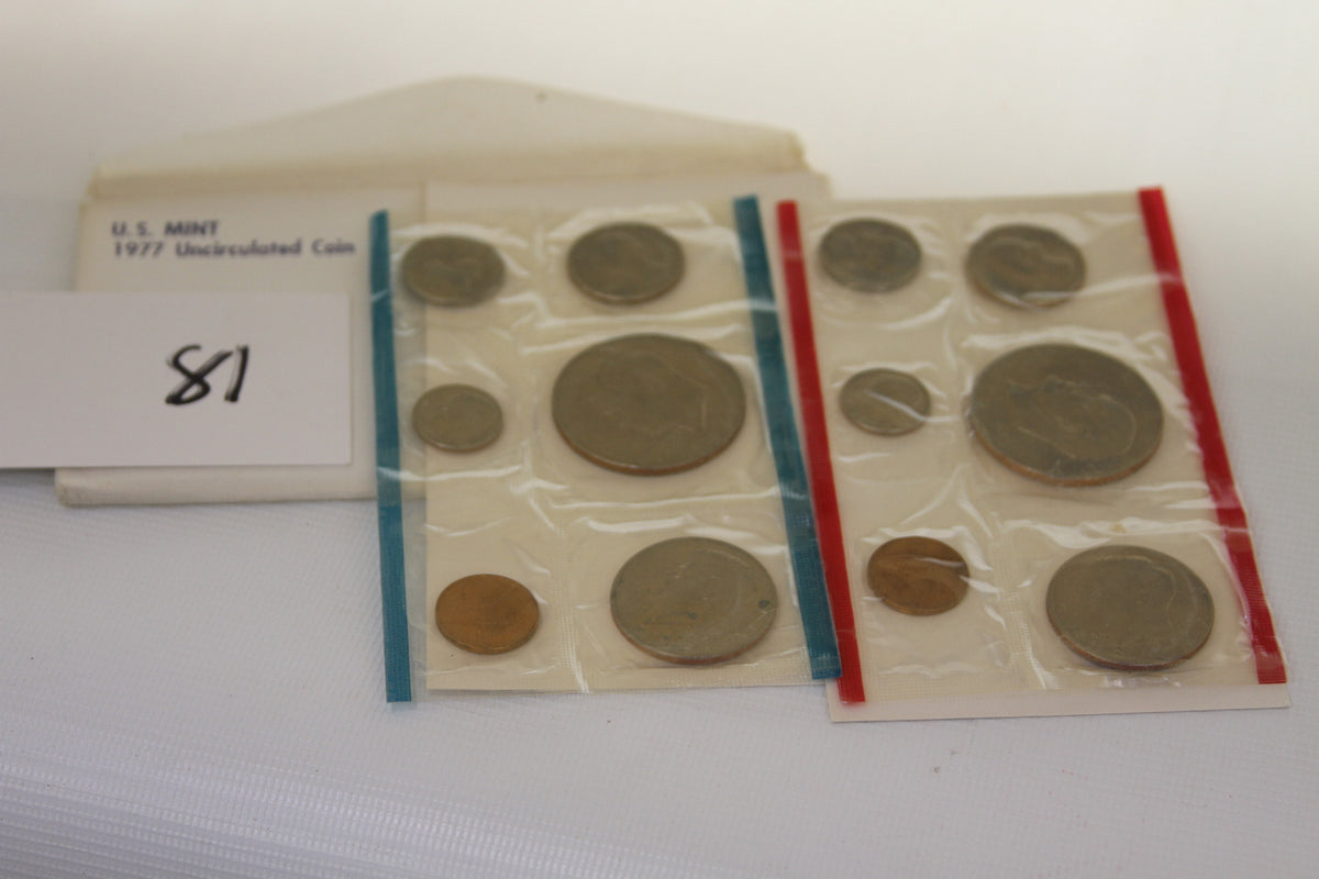 1977 U.S. Mint uncirculated coin set in sealed packaging with envelope