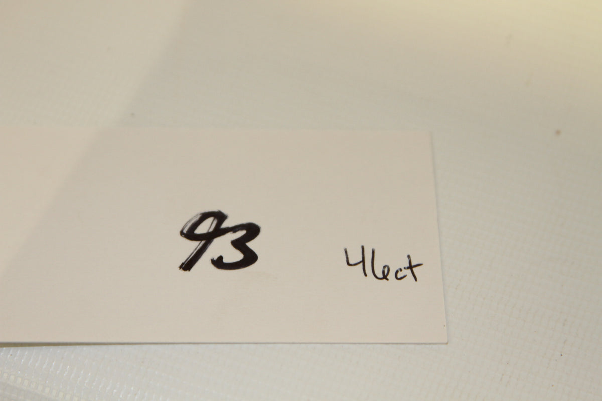 White card with handwritten number 93