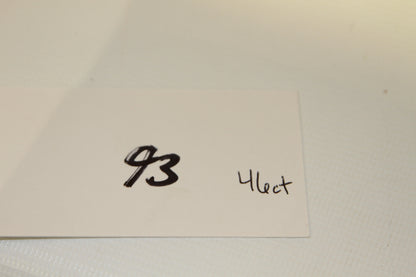 White card with handwritten number 93