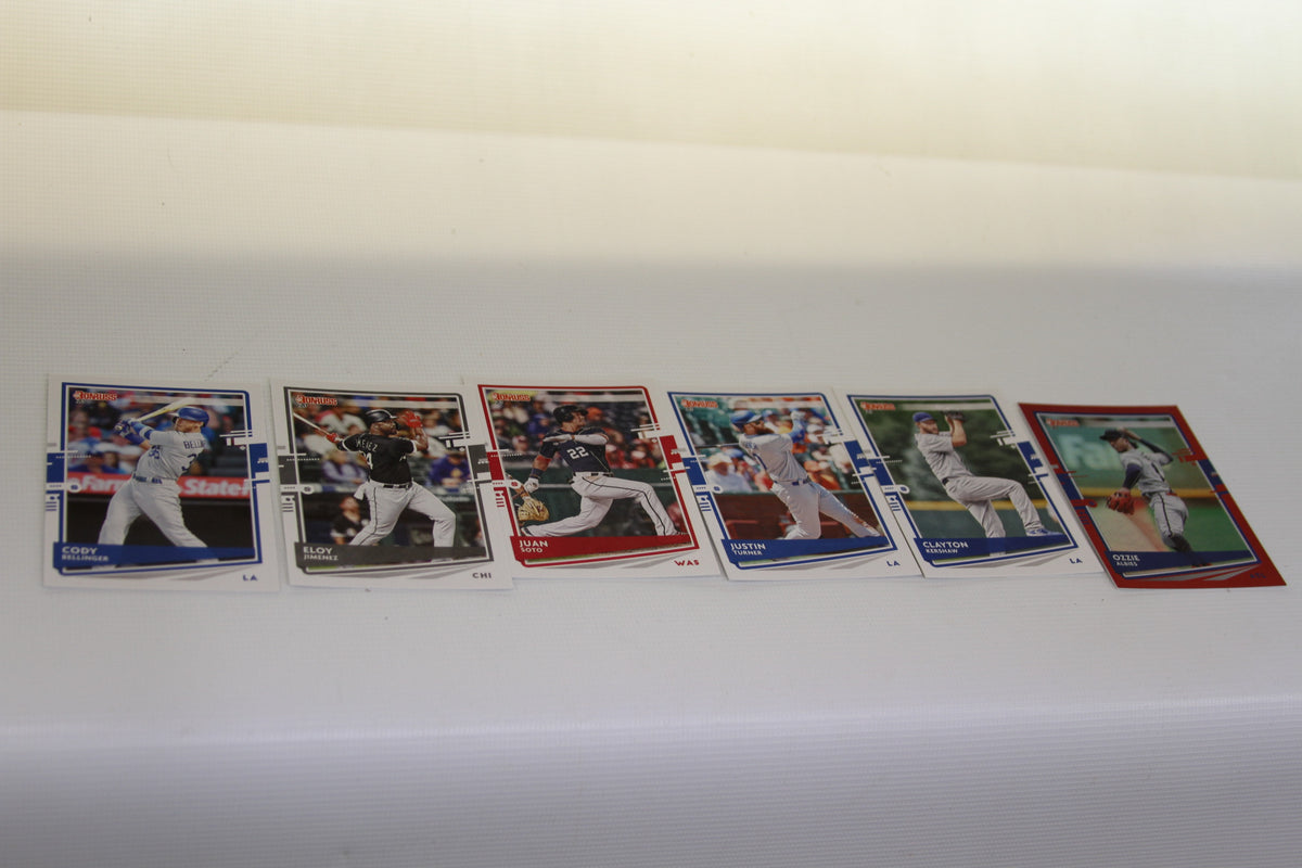 Assorted Topps and Donruss baseball cards of Cody Bellinger, Eloy Jimenez, Juan Soto, Justin Turner, Clayton Kershaw, and Ozzie Albies