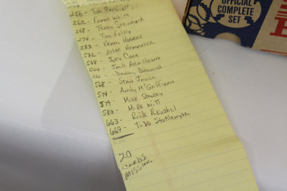 Handwritten checklist noting missing and included cards in the 1990 set