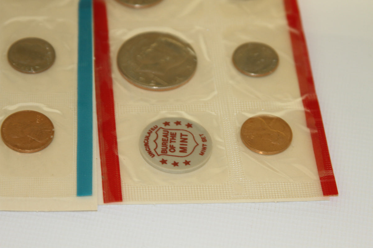 Closeup of 1972 U.S. Mint Set coins in red edged sleeve with mint token