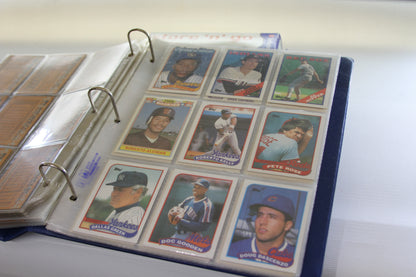 Binder page featuring Topps baseball cards including Roberto Alomar and Pete Rose