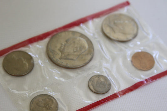 Close-up of sealed uncirculated coins from the 1978 U.S. Mint set with red border
