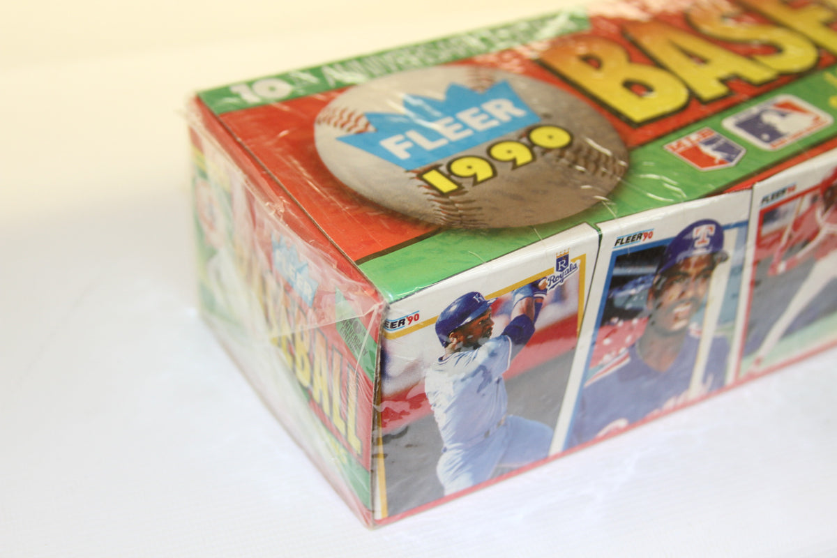 Corner of 1990 Fleer Baseball Card Box showing MLB graphics and players