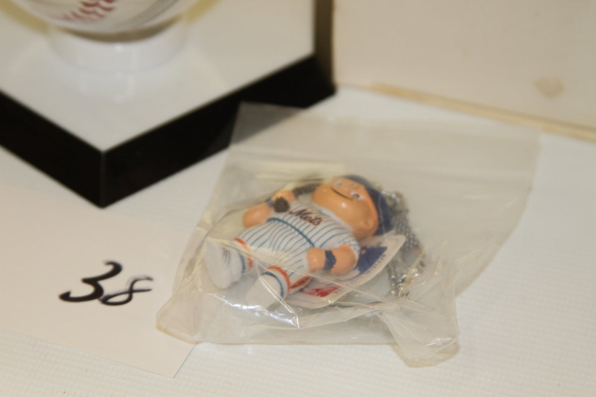 Close-up of Mets mascot keychain in packaging