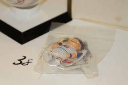 Close-up of Mets mascot keychain in packaging