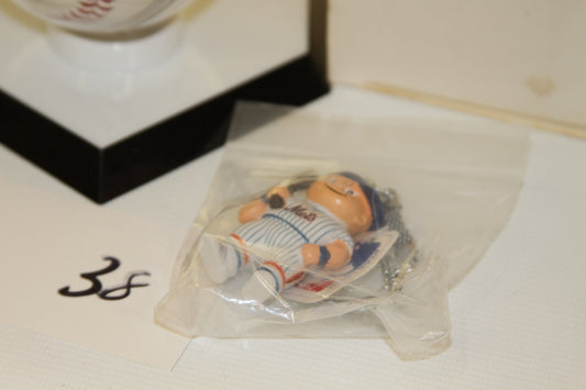 Close-up of Mets mascot keychain in packaging