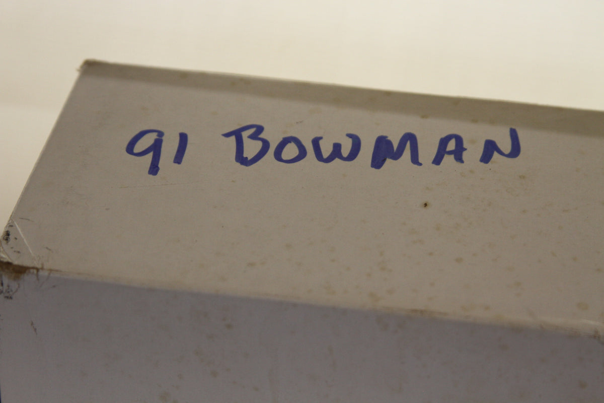 Close-up of 91 Bowman handwritten label on box
