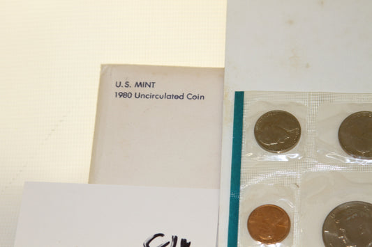 Close-up of 1980 U.S. Mint Uncirculated Coin Set envelope and coins
