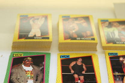 Close-up of WCW Sting and Sid Vicious trading card stacks