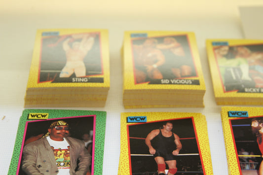 Close-up of WCW Sting and Sid Vicious trading card stacks