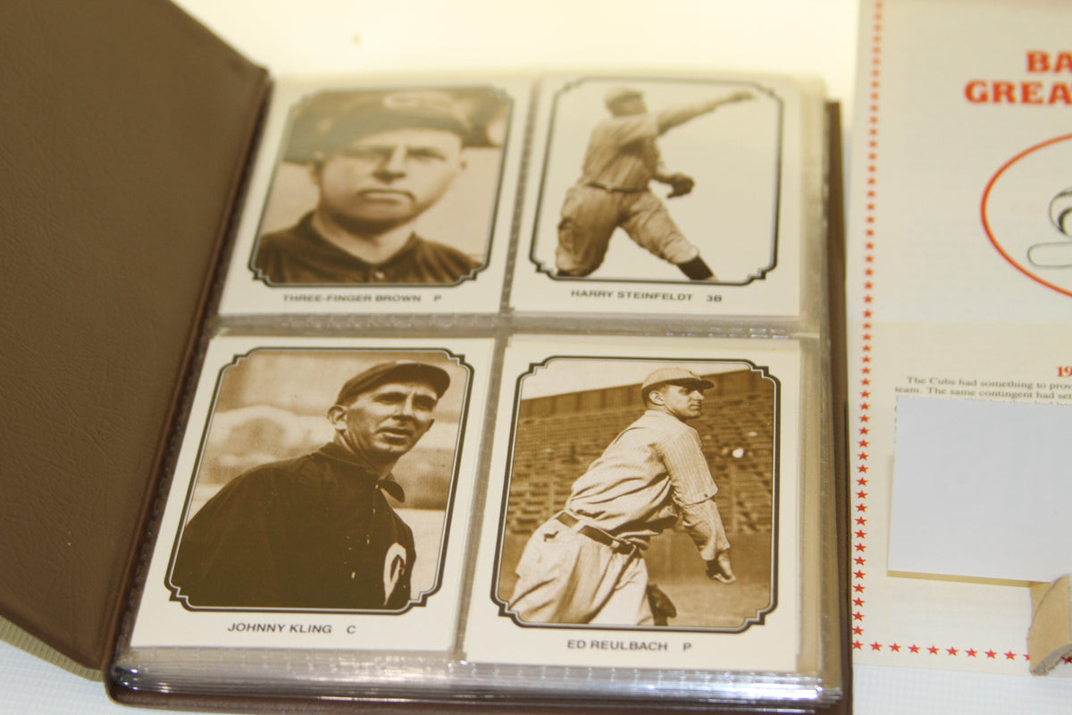 Open card album showing vintage baseball cards in sleeves