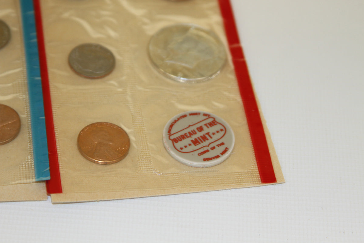 Close-up of US Mint uncirculated coin set in red-edged plastic sleeve