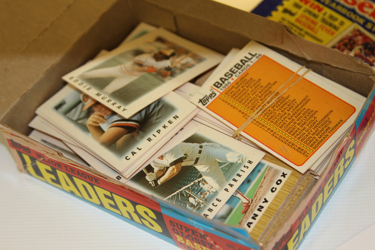 Open Topps baseball cards box showing player cards and checklist