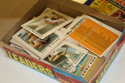 Open Topps baseball cards box showing player cards and checklist