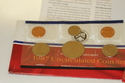 Partial view of 1987 Uncirculated Coin Set with visible coins and packaging